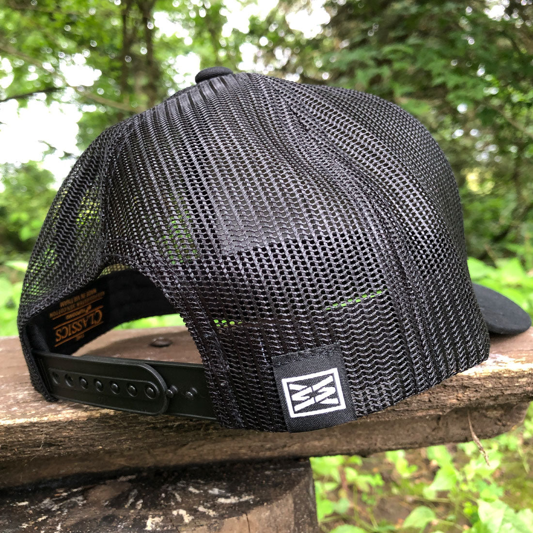 black trucker hat, RIZNWILD snapback, curved bill mesh hat, embroidered logo hat, outdoor lifestyle cap, everyday trucker hat, men’s black hat, streetwear cap